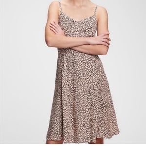 Cheetah heart print smocked cami dress with adjustable straps.